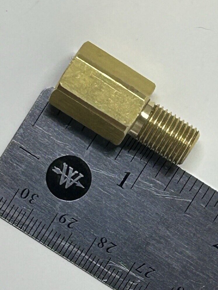 photo of brass antenna adapter beside a ruler