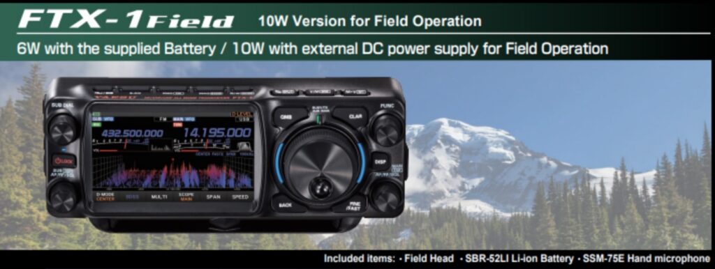 Photo of an amateur radio superimposed over a background with snow-capped mountains and tall evergreen trees. the text on the image says FTX-1 Field 10 watt version for field operation. 6 watts with the supplied battery./ 10 watts with external DC power supply for field operation.